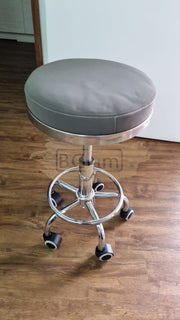 Adjustable Stool on wheels with footrest - Grey